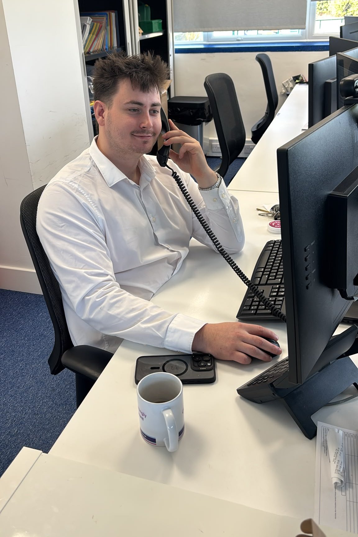 A Cloud & More engineer answering a support call at his desk